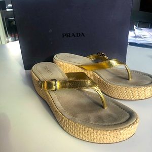 Prada size 41 Gold leather thong sandal with 2”platform base/Woven raffia sides.